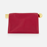 The JACQUEMUS La Pochette Rond Carre Clutch is a rectangular red leather purse with a smooth finish, featuring bold gold accents that embody chic French style, displayed elegantly against a plain white background.