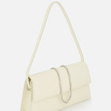 The JACQUEMUS Le Bambino Long Ostrich Bag is a cream-colored, off-white leather handbag made in Italy with a rectangular design, single shoulder strap, ostrich-embossed finish, and a large curved silver metal accent on the front flap.