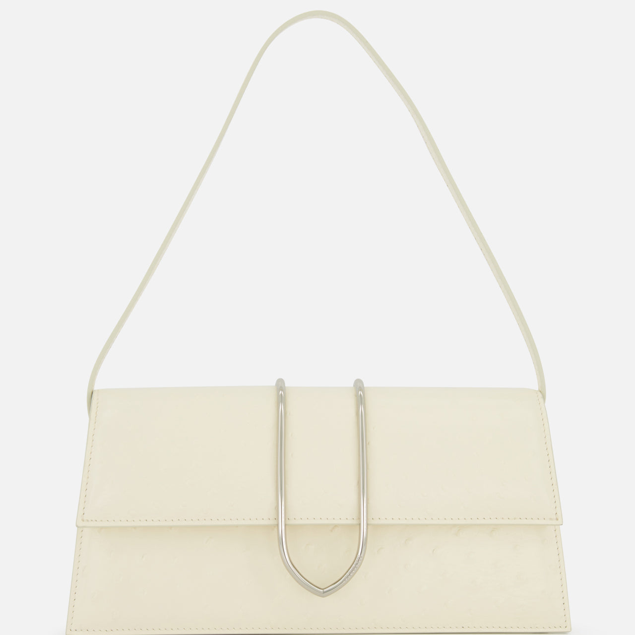 The JACQUEMUS Le Bambino Long Ostrich Bag is a minimalist off-white Italian leather top-handle bag, featuring a rectangular silhouette, ostrich embossed finish, single strap, and metallic U-shaped front detail against a plain white background.