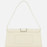 The JACQUEMUS Le Bambino Long Ostrich Bag features a cream ostrich-embossed finish, a single slim shoulder strap, front pocket, and metallic top clasp. Its minimalist design and subtle texture make a striking statement.