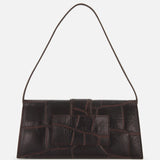 The JACQUEMUS Le Bambino Long Croco-effect Shoulder Bag is a rectangular, dark brown leather bag with a textured finish and adjustable strap, shown against a plain white background.