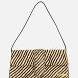 The Le Bambino Long Zebra Shoulder Bag by JACQUEMUS is a rectangular, zebra-print calf hair accessory featuring a short strap and gold JACQUEMUS branding in the lower right corner. Made in Italy, it is shown against a white background.