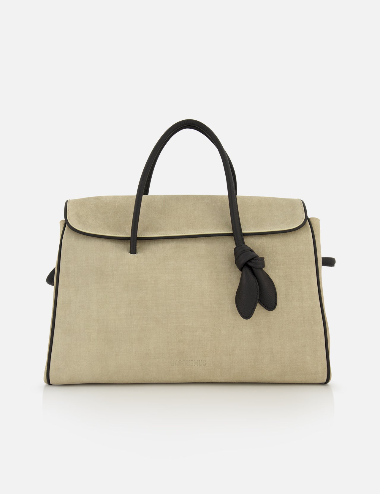 JACQUEMUS Le Cabas Turismo Tote Bag in beige suede featuring black piping, black handles, a decorative knotted tie accent, and a detachable shoulder strap.