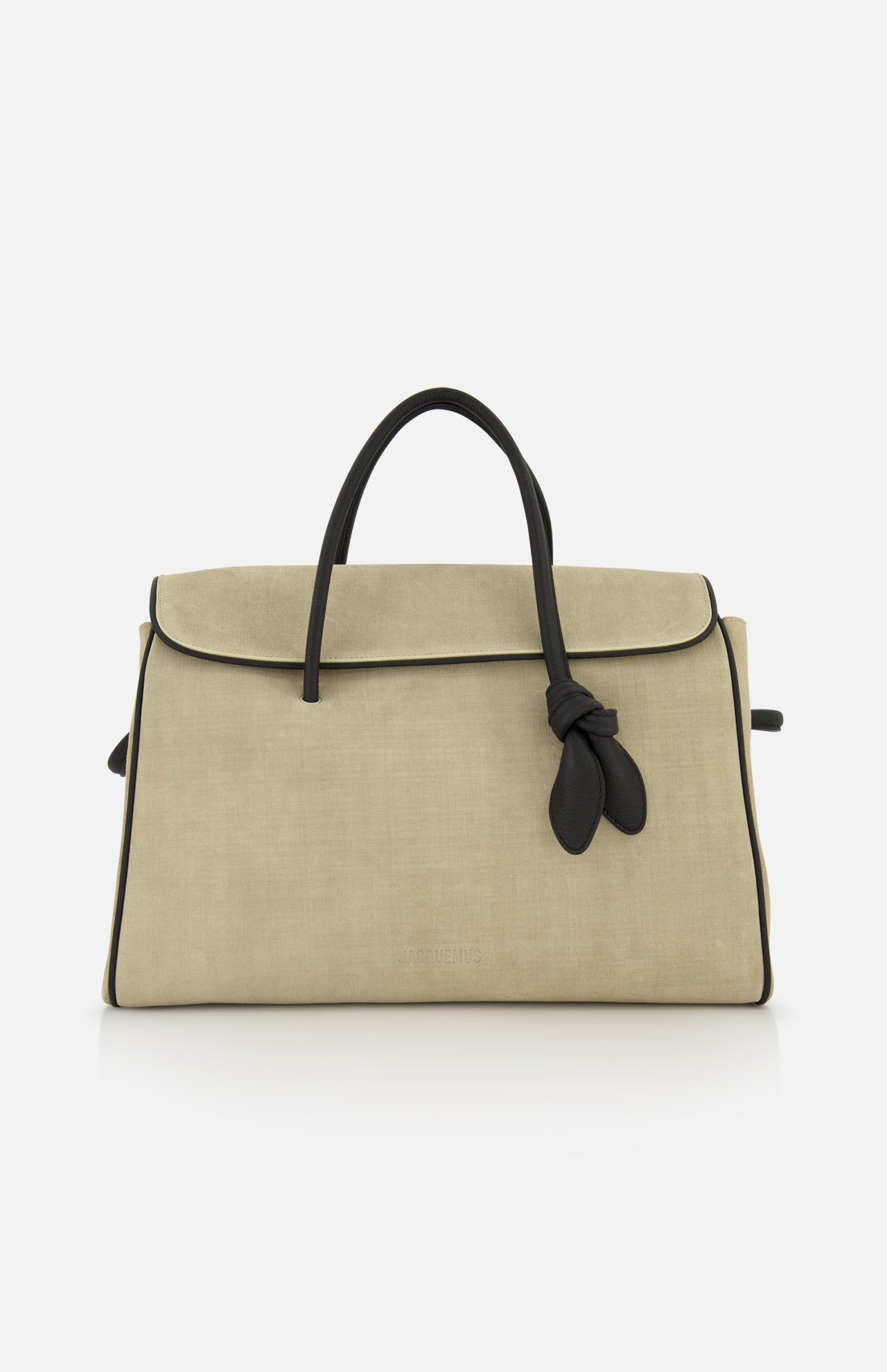 JACQUEMUS Le Cabas Turismo Tote Bag in beige suede featuring black piping, black handles, a decorative knotted tie accent, and a detachable shoulder strap.