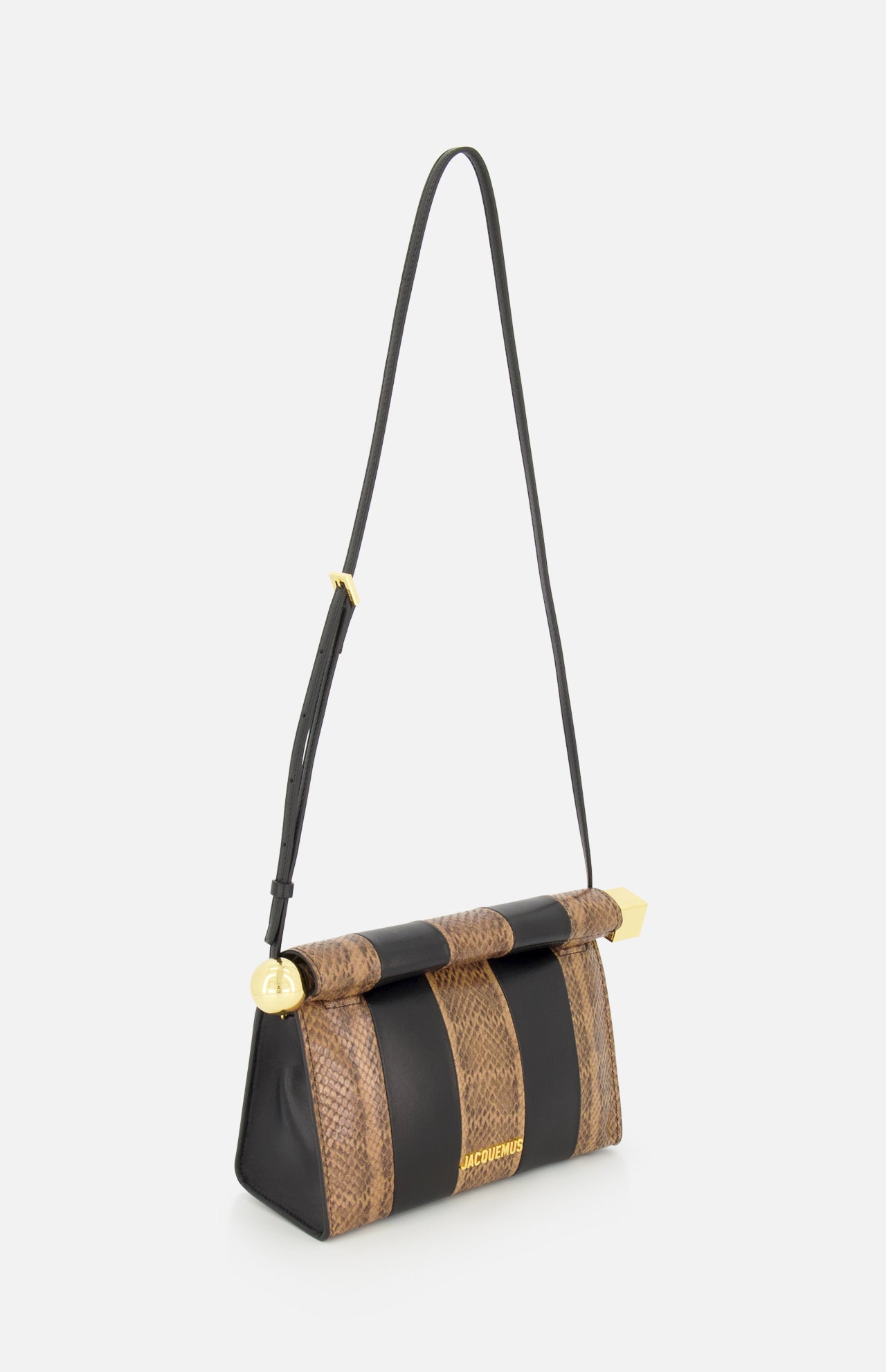 Introducing the Le Sac Rond Carre Clutch by JACQUEMUS—a stylish handbag crafted from python-embossed leather with a brown snakeskin-patterned flap, complemented by black vertical stripes and luxurious gold hardware. The gold JACQUEMUS logo adorns the lower front, while an adjustable and detachable black strap allows for versatile wear as either a clutch or shoulder bag.