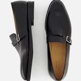 The JOHN LOBB Delano II Oxford Loafer, crafted in black leather with buckle detail, is displayed from the side and top views against a plain white background.