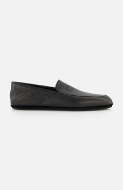 The JOHN LOBB Kingston II Loafer is a black shoe featuring a textured surface, flat sole, and minimalistic slip-on design, shown against a plain white background.