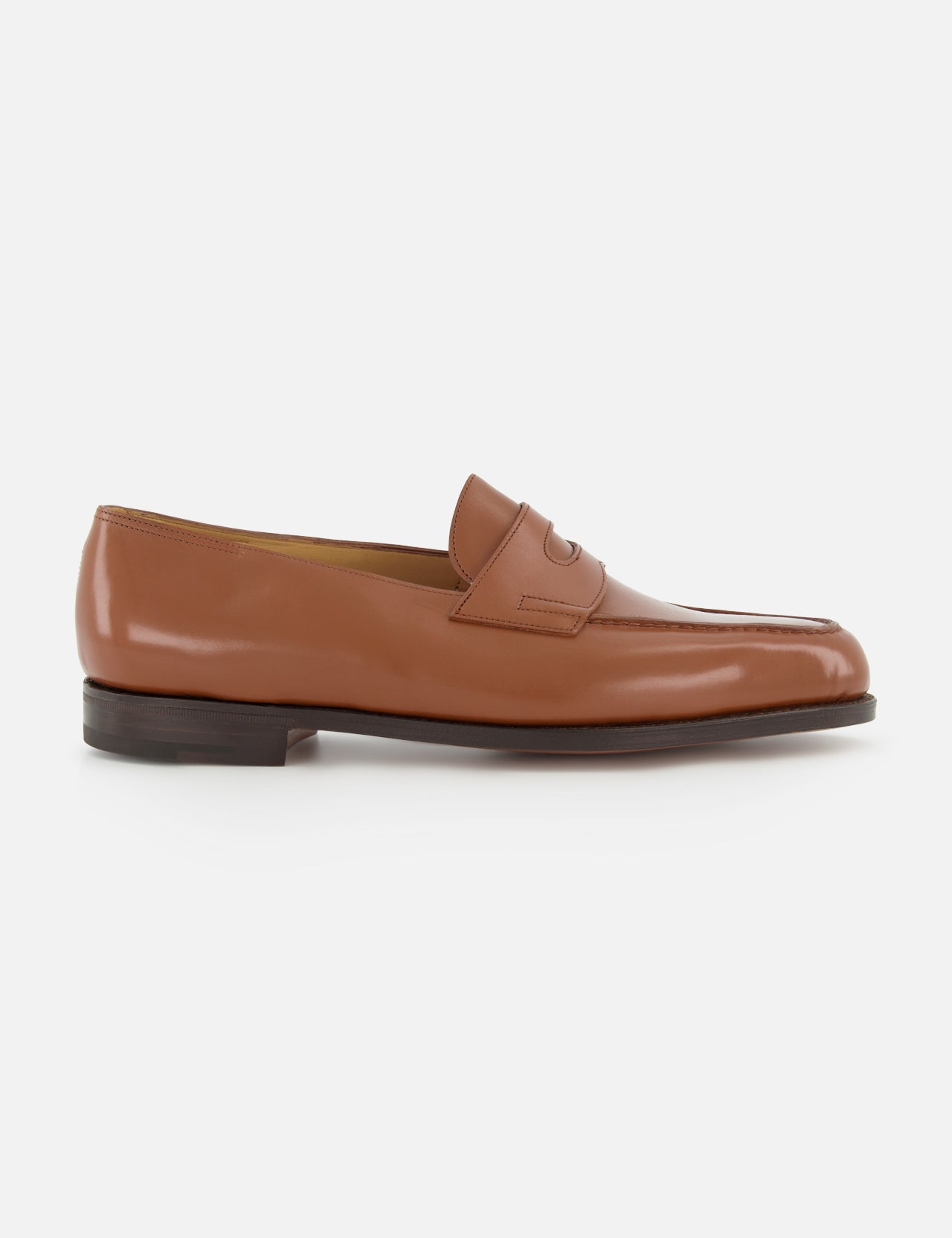 The JOHN LOBB Lopez Leather Penny Loafer is a brown men's dress shoe with a low black heel and penny strap detail, shown in profile on a white background.