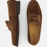 The JOHN LOBB Lopez Suede Loafer, in dark brown suede with visible stitching and classic design, is handmade in England. Shown are the left shoe (side view) and right shoe (top view), set against a plain white background.