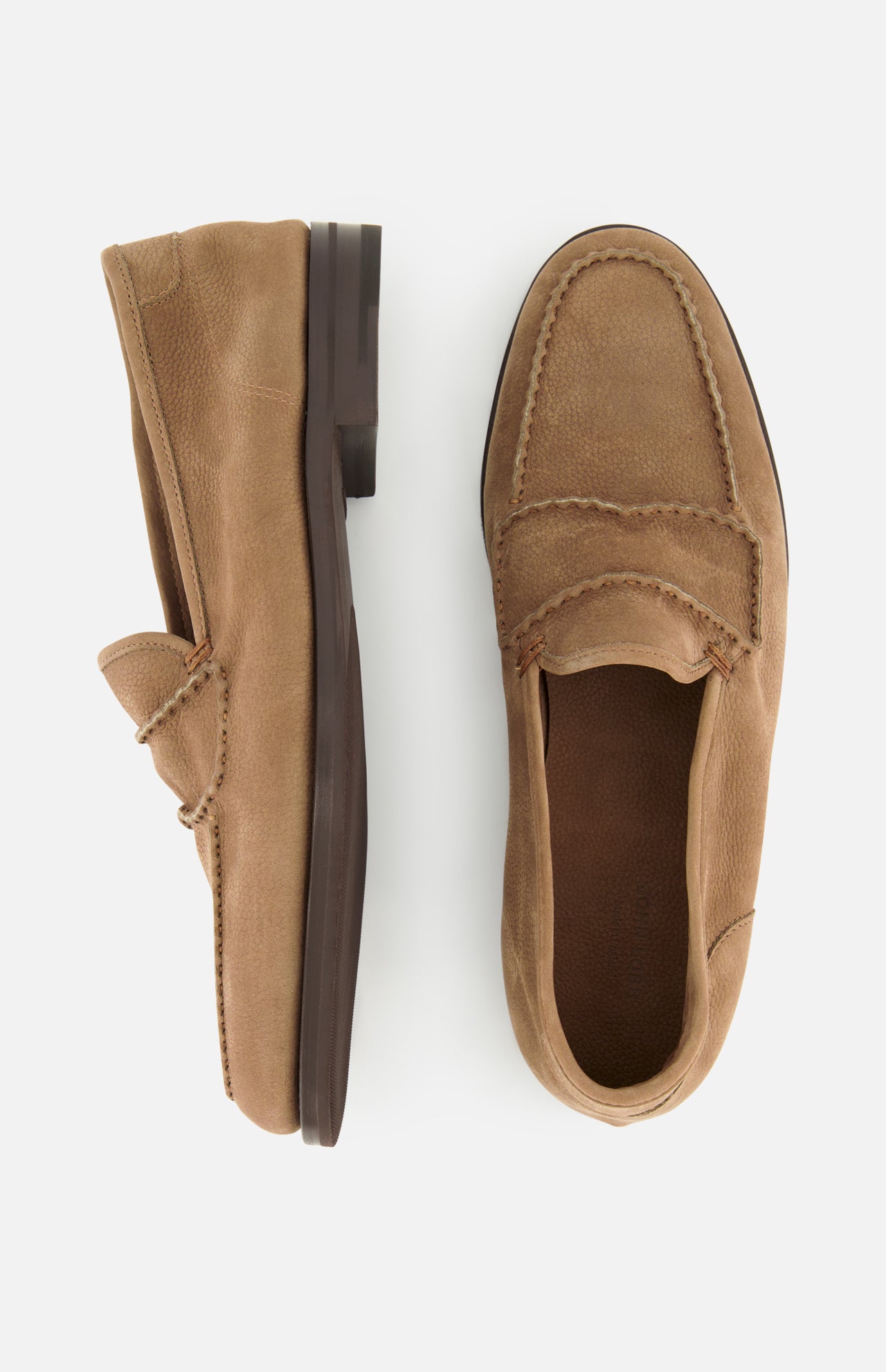 The JOHN LOBB Bath Nubuck Loafer, a pair of tan suede handmade men’s loafers with brown soles, is displayed from the side and top views on a white background.