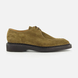 The Smith Suede Loafer by JOHN LOBB is an olive green suede lace-up dress shoe featuring a rounded toe and a thick black sole, inspired by classic English creepers, displayed in side profile against a white background.