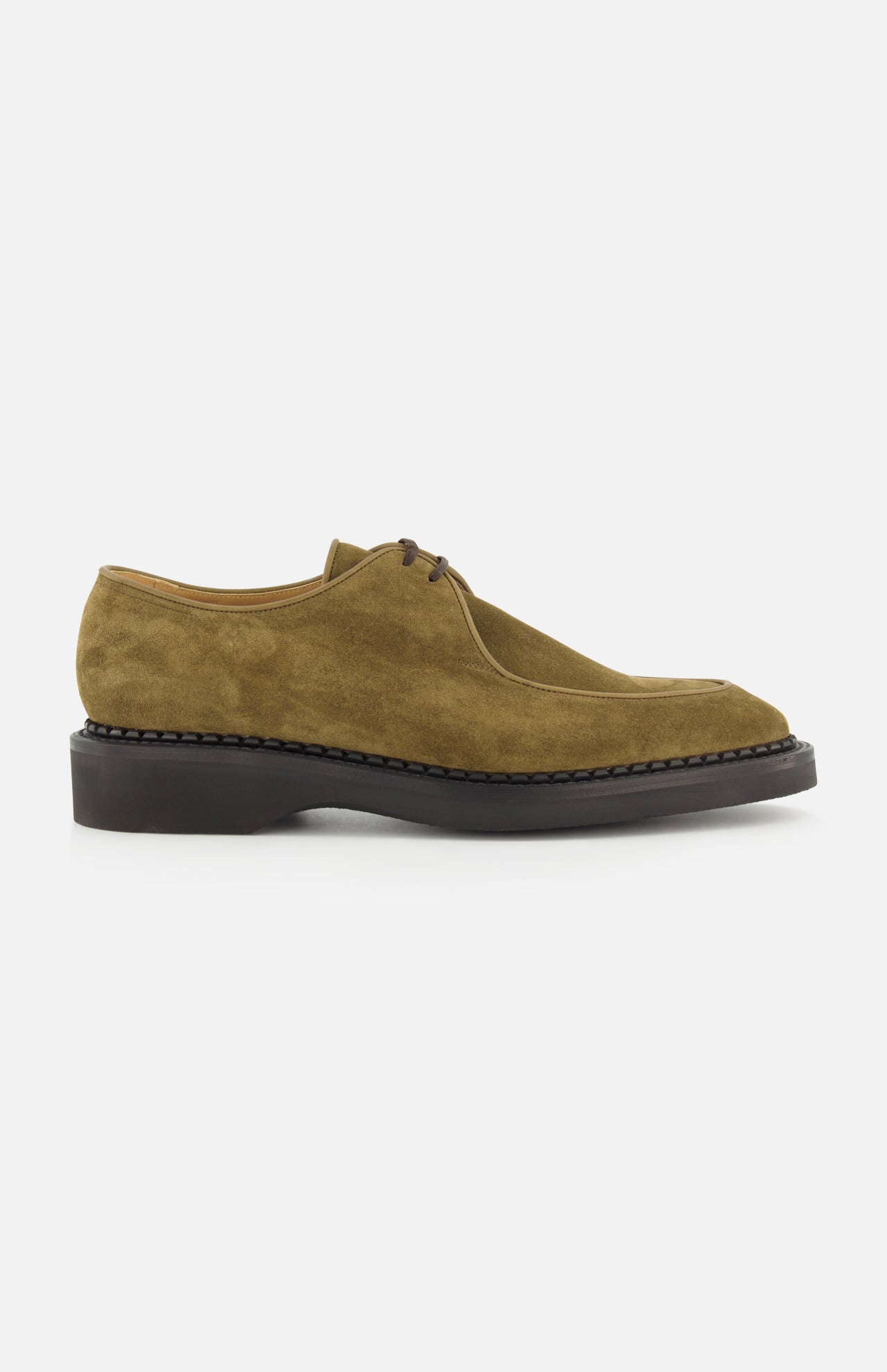The Smith Suede Loafer by JOHN LOBB is an olive green suede lace-up dress shoe featuring a rounded toe and a thick black sole, inspired by classic English creepers, displayed in side profile against a white background.