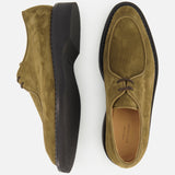 A pair of Smith Suede Loafers by JOHN LOBB in olive green suede with thick black soles, displayed from the side and top on a white background.
