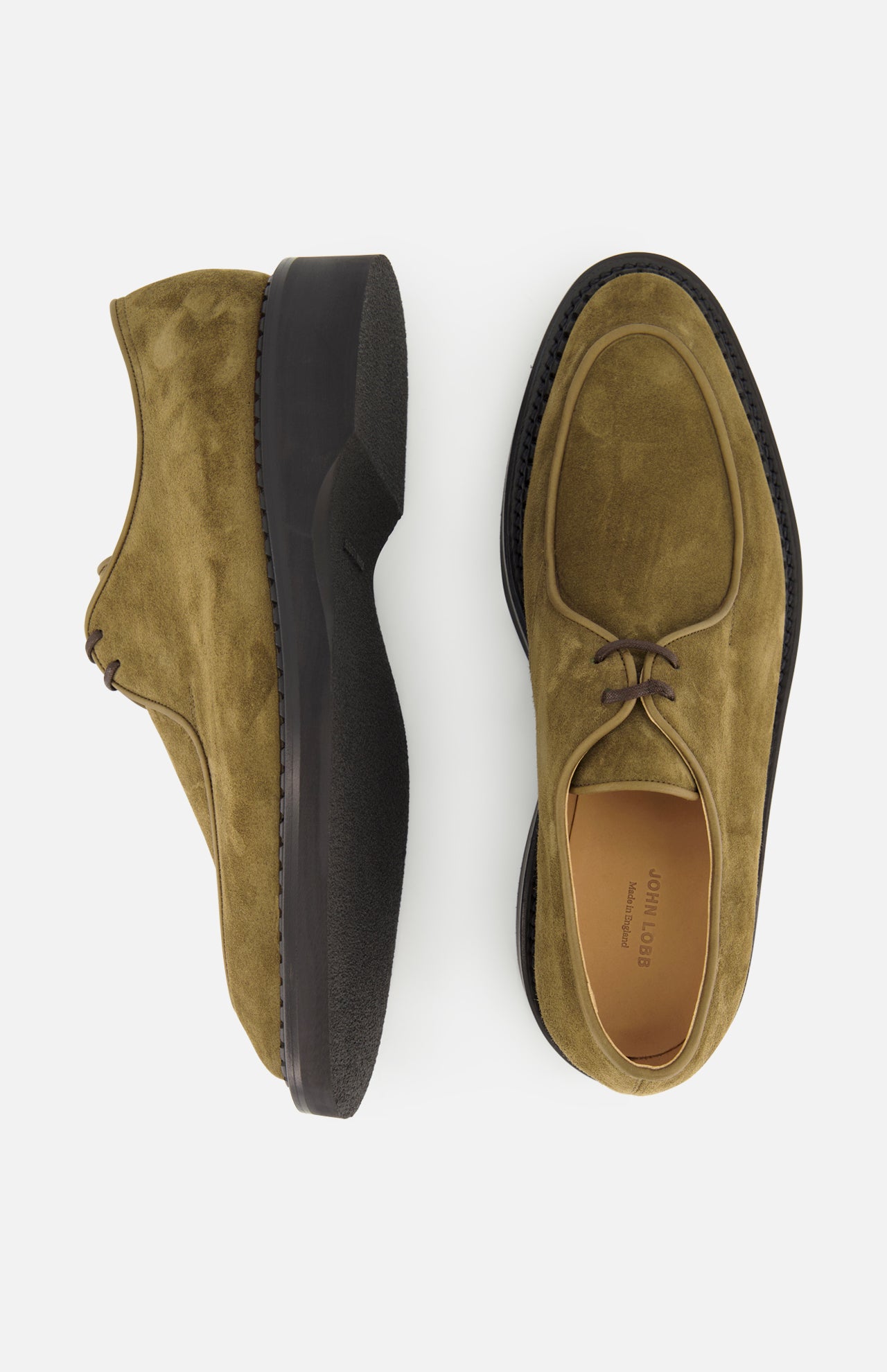A pair of Smith Suede Loafers by JOHN LOBB in olive green suede with thick black soles, displayed from the side and top on a white background.