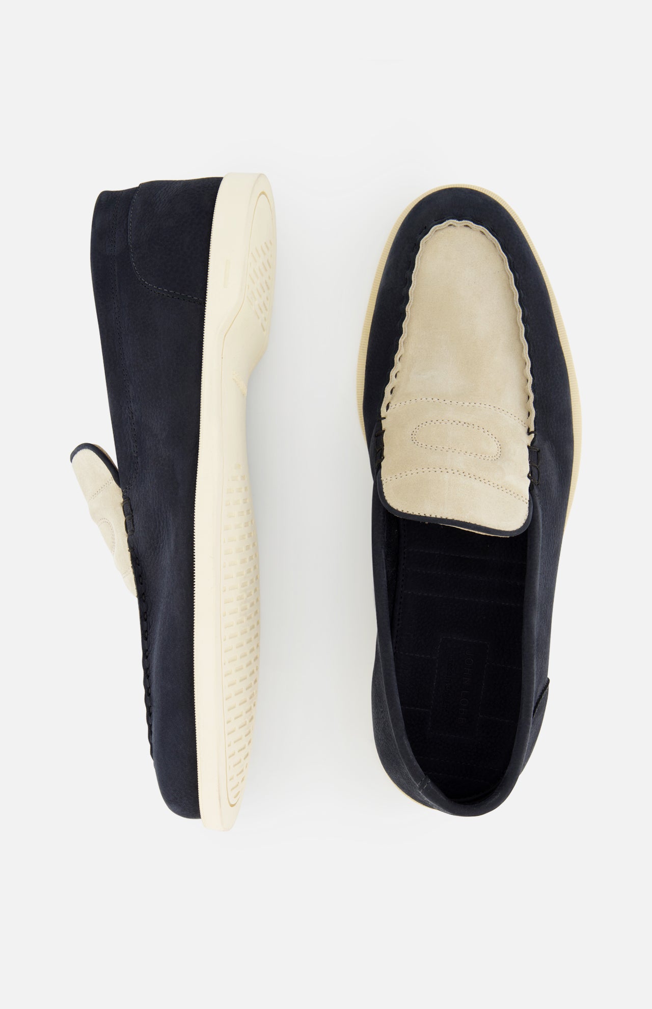 Top view of JOHN LOBB Pace Suede 2 Tones Loafer, made in England with cream suede uppers, dark navy sides and soles, visible stitching, and textured off-white super flex rubber soles.