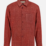 Introducing the Luis Oversized Long Sleeve Shirt by KARDO—a deep brick red cotton shirt featuring a subtle, intricate geometric pattern. This classic button-up style offers an oversized fit, classic collar, and chest pocket, blending timeless design with modern comfort.