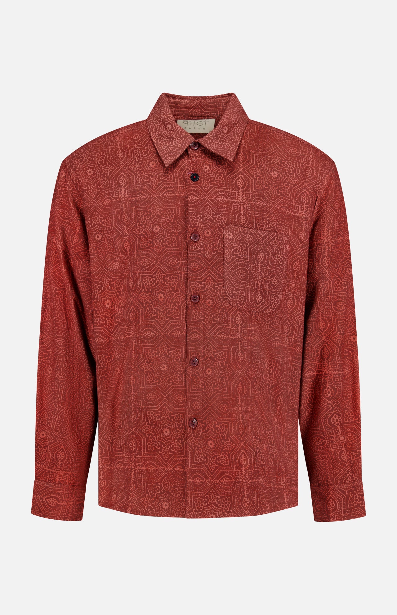 Introducing the Luis Oversized Long Sleeve Shirt by KARDO—a deep brick red cotton shirt featuring a subtle, intricate geometric pattern. This classic button-up style offers an oversized fit, classic collar, and chest pocket, blending timeless design with modern comfort.