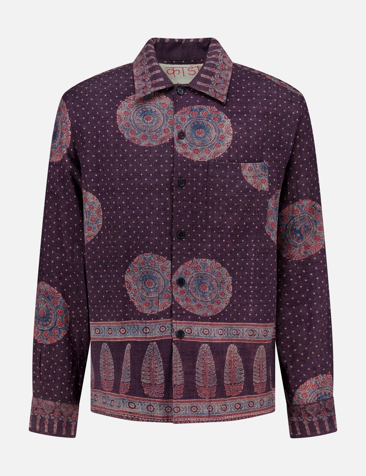 The Martin Relaxed Fit Long Sleeve Shirt from KARDO is a printed, relaxed-fit button-up featuring a purple base with blue and red circular and dotted patterns, highlighted by decorative border designs along the hem, cuffs, and lower sleeves.