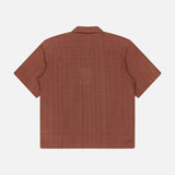 Back view of the KARDO Rohit Stripe Short Sleeve Shirt—an oversized, 100% cotton brown shirt with a subtle textured stripe pattern—shown on a plain white background.