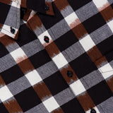 Close-up of the KARDO Ronald Checkered Long Sleeve Shirt, featuring a black, white, and brown plaid pattern. Made from 100% cotton, this shirt showcases black buttons and a visible collar.