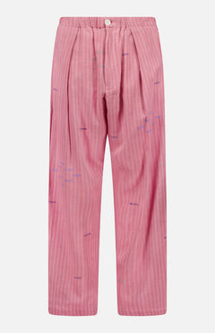 The KARDO Taka Striped Trouser Pants are relaxed-fit, high-waisted cotton pants with front pleats, button closure, subtle white stripes, and purple embroidered accents.