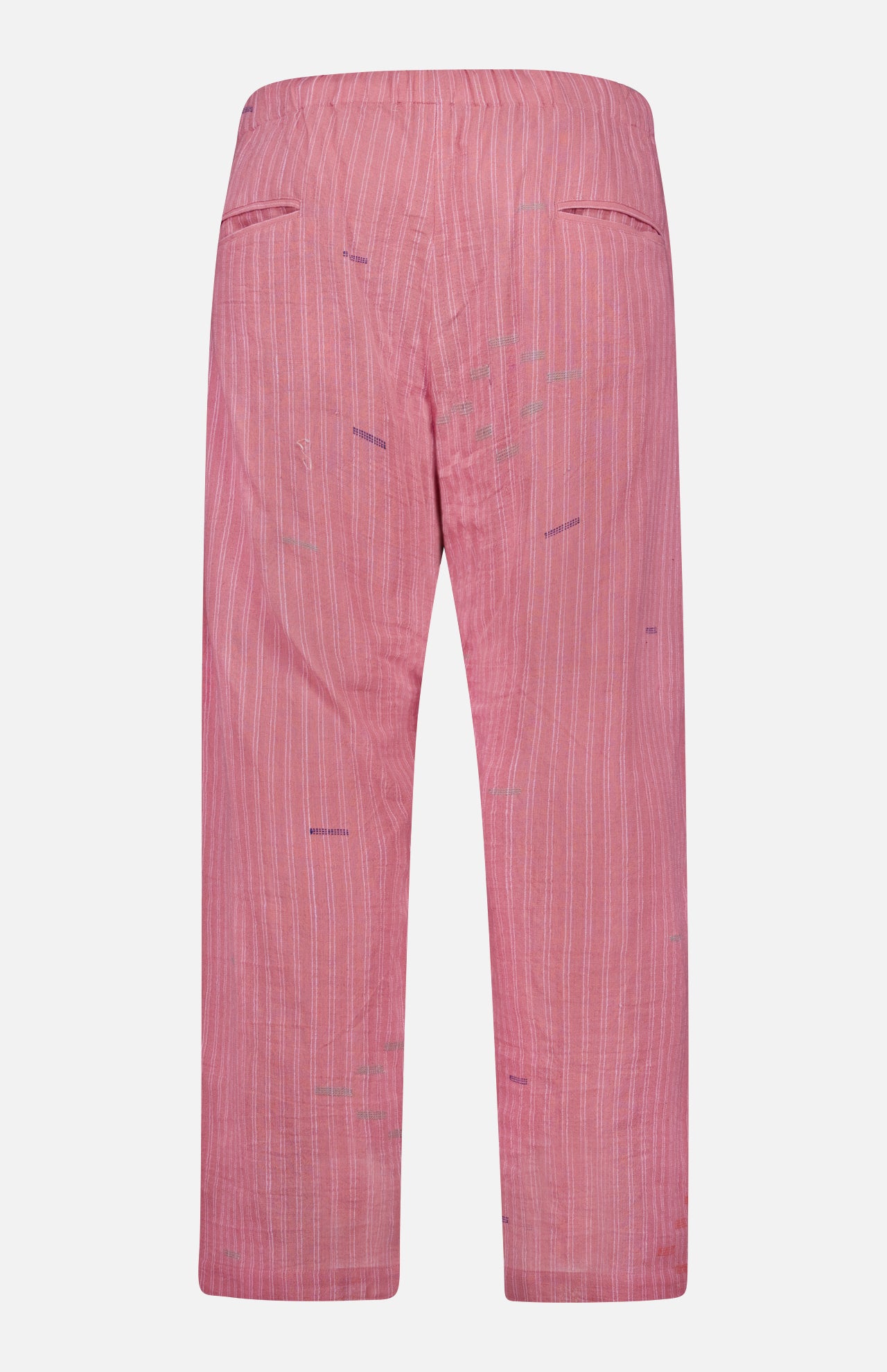 Back view of KARDO's Taka Striped Trouser Pants featuring pink fabric with thin vertical white stripes, subtle purple stitching, an elastic waistband, and two welt pockets at the upper back.