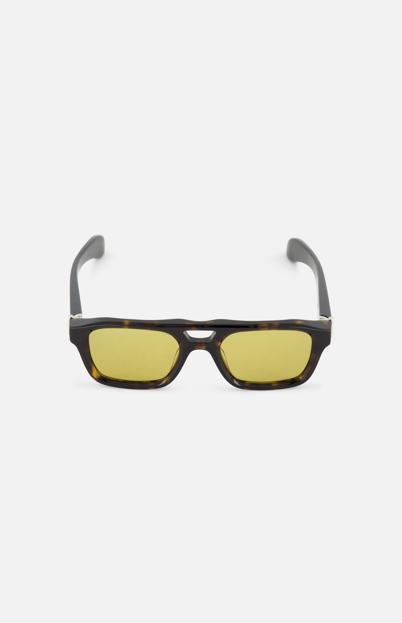 Alexander McQueen Pilot Brown Sunglasses by ALEXANDER MCQUEEN with dark brown frames and yellow-tinted lenses, shown on a white background.