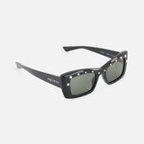 The Alexander McQueen Cat Eye Black Sunglasses by ALEXANDER MCQUEEN feature a sleek rectangular cat eye frame, metallic side studs, dark lenses, and branded temples, shown on a white background.
