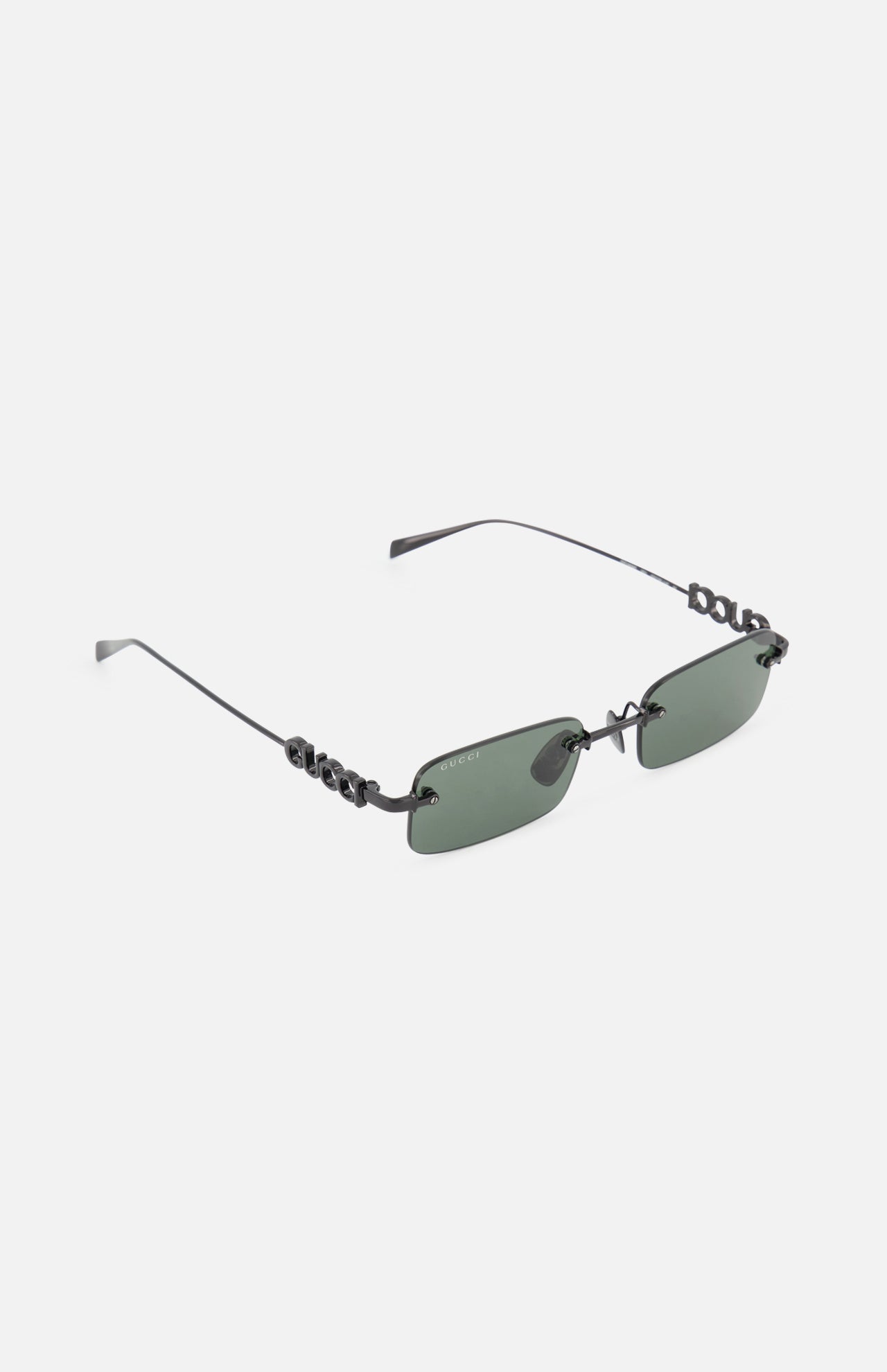 Gucci Rectangular Black Sunglasses by GUCCI feature a rimless design with dark green lenses, sleek black arms, and metallic branding on the temples, displayed on a white background.