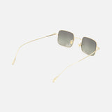 The GUCCI Square Gold Sunglasses feature thin gold metal frames and gray tinted lenses. Shown angled on a white background, these unisex shades have long, slender temples and clear nose pads.