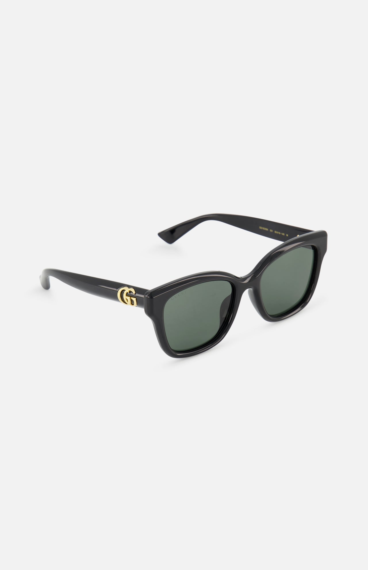 Gucci Round Black Sunglasses by GUCCI feature dark green lenses and gold GG logo details on the temples, shown here against a plain white background.