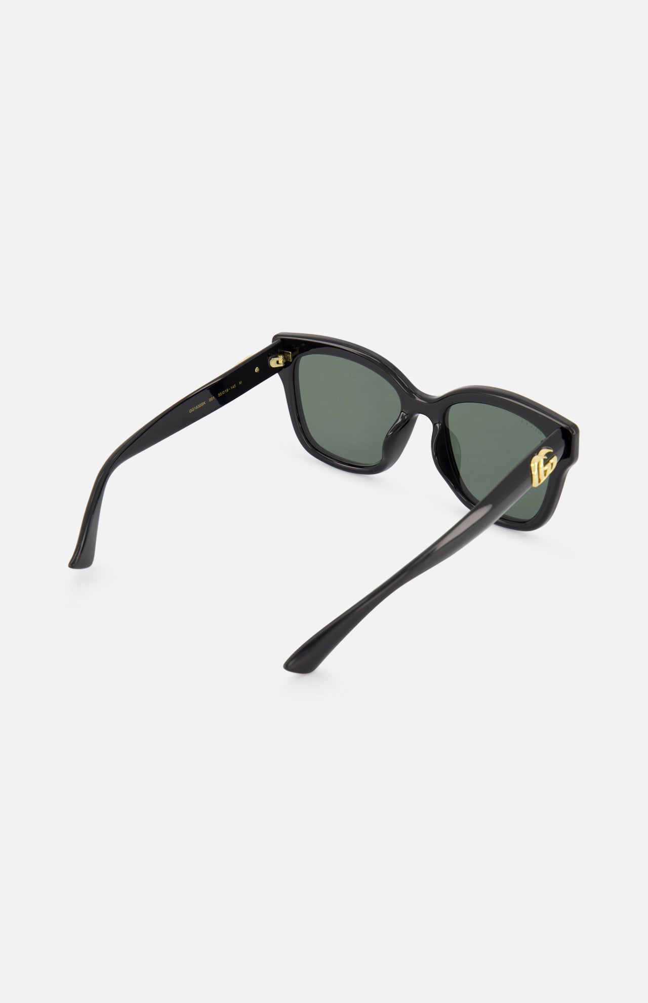Gucci Round Black Sunglasses by GUCCI are shown on a plain light background, featuring sleek round black frames—ideal for those seeking a chic upgrade from classic square sunglasses.