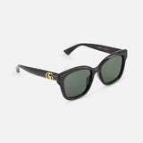 Gucci Round Black Sunglasses featuring a black round frame, dark lenses, and a gold logo on the temple.
