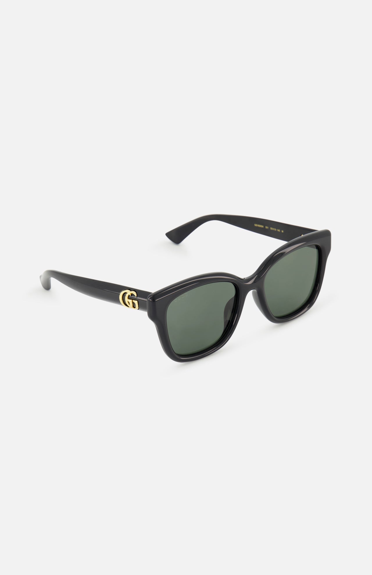 Gucci Round Black Sunglasses featuring a black round frame, dark lenses, and a gold logo on the temple.