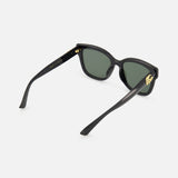 Gucci Round Black Sunglasses featuring a round frame with dark green lenses and gold hardware on the temples.