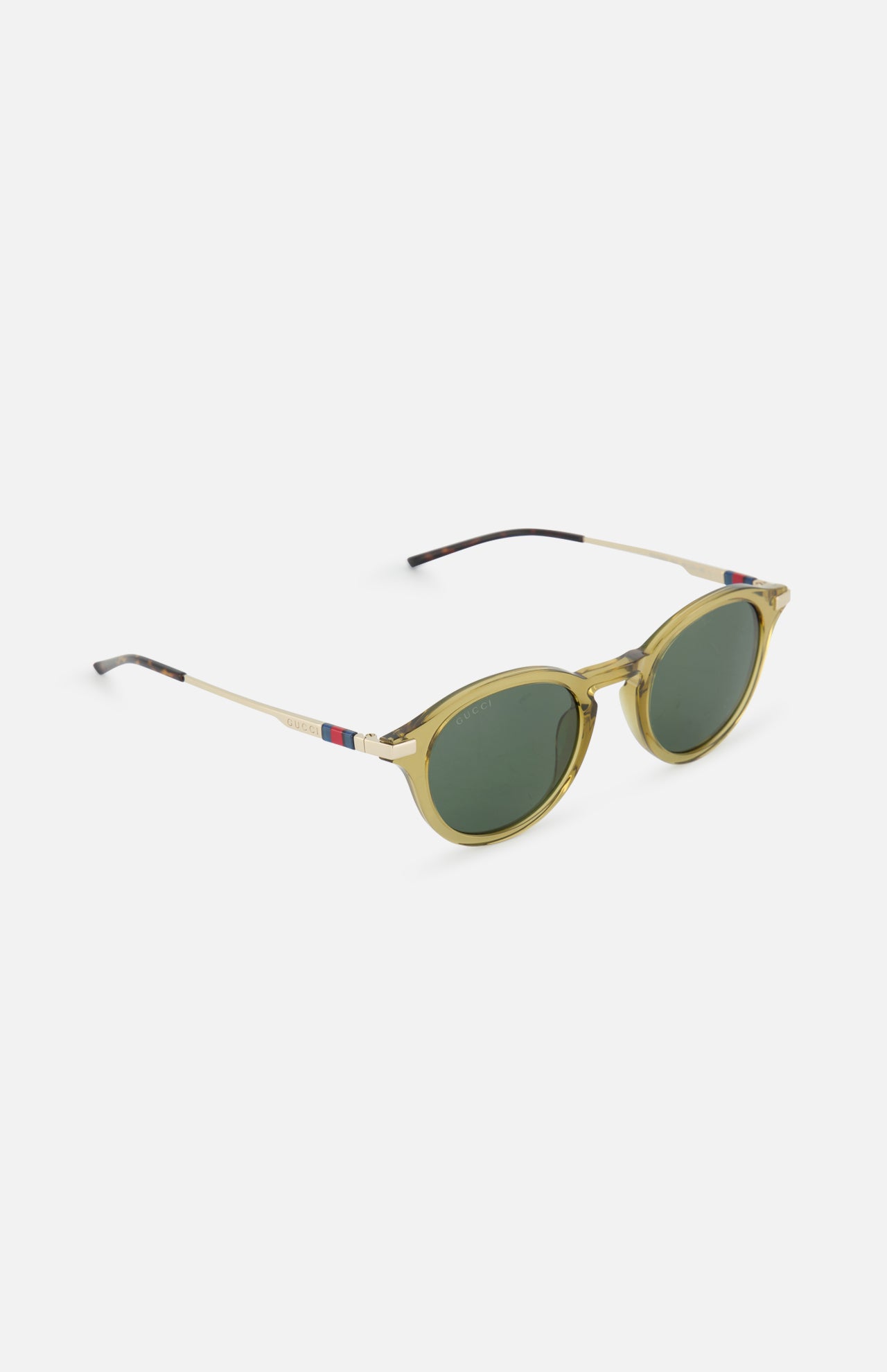 Gucci Round Brown Sunglasses by GUCCI feature thin gold frames, green lenses, and red, white, and blue detailing near the hinges. Stylishly designed with round frames, these sunglasses are set against a plain white background.