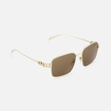 Gucci Square Gold Sunglasses by GUCCI feature gold-rimmed square metal frames, brown lenses, and decorative floral temple details. Minimalist style shown on a plain white background.