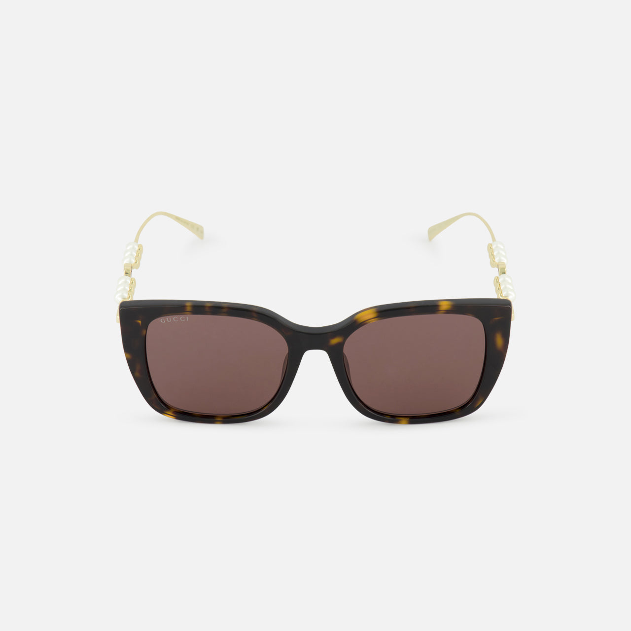 GUCCI Brown Tortoiseshell Sunglasses with brown lenses and gold temples adorned with pearl accents, shown on a plain white background.