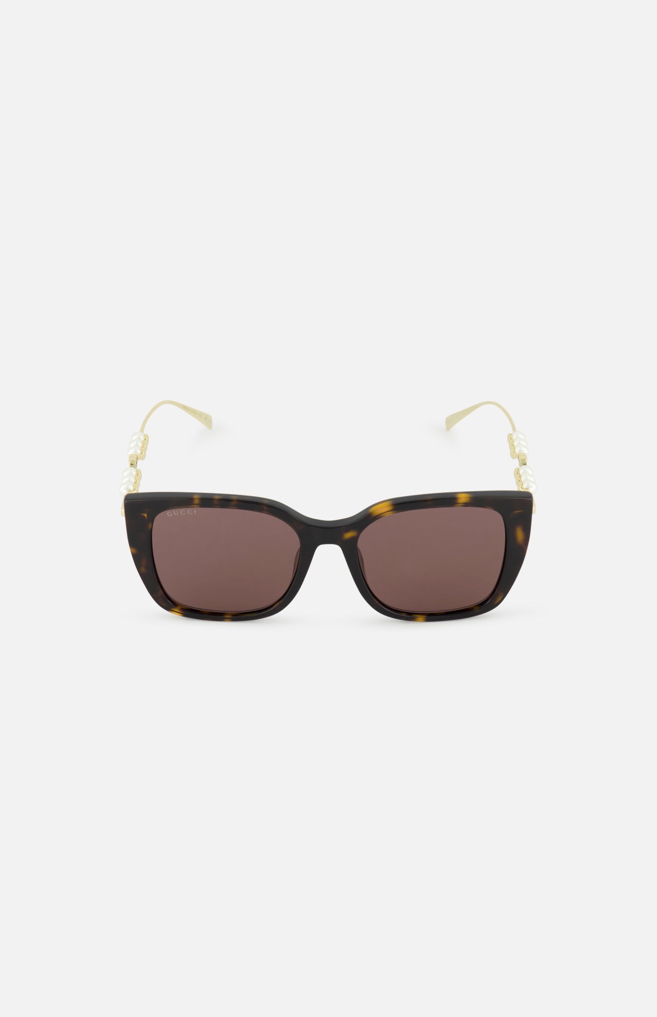 GUCCI Brown Tortoiseshell Sunglasses with brown lenses and gold temples adorned with pearl accents, shown on a plain white background.