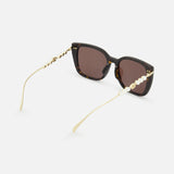 Gucci Brown Tortoiseshell Sunglasses featuring a butterfly frame with gold-toned temples embellished with pearls and logos.