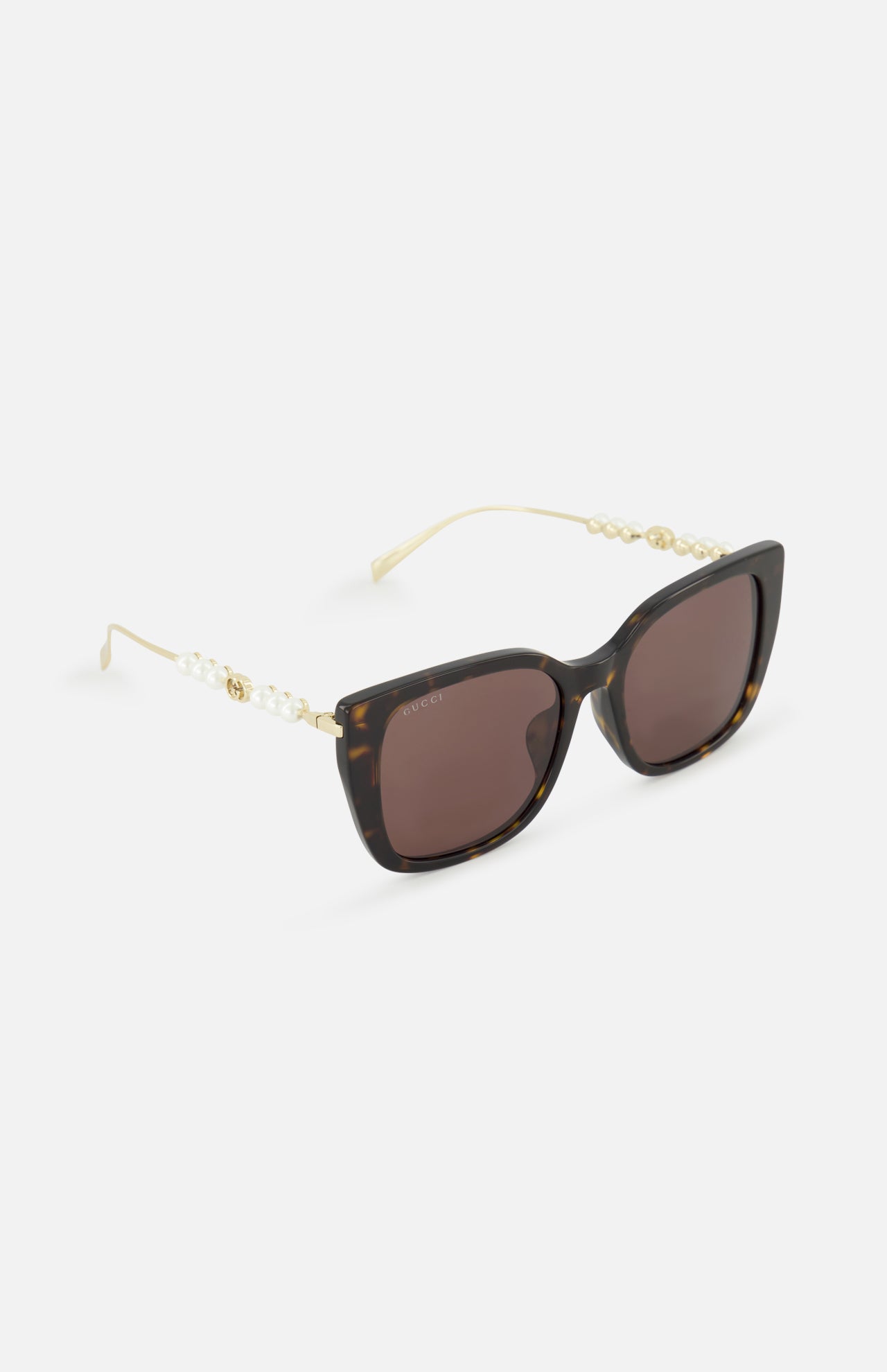 Gucci Brown Tortoiseshell Sunglasses featuring a butterfly frame and pearl-accented gold temples.