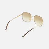 Gucci Rectangle Gold Sunglasses by GUCCI feature a gold rectangular frame, brown gradient lenses, thin arms, and dark brown tips, elegantly displayed on a white background.