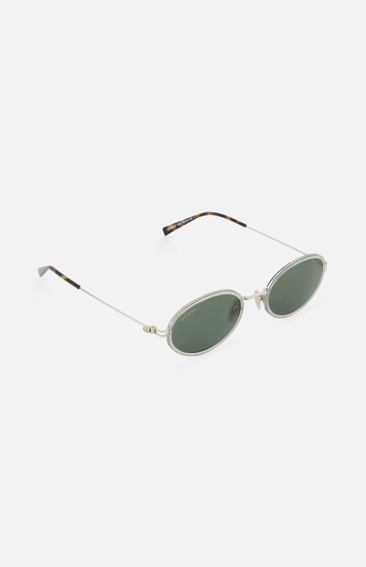 Gucci Oval Metal Sunglasses by GUCCI feature thin silver metal frames, dark green lenses, and tortoiseshell temple tips, shown on a white background.