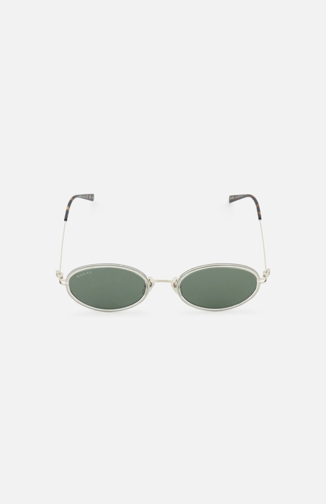 Gucci Oval Metal Sunglasses by GUCCI feature oval green-tinted lenses, slim grey metal frames, and black-tipped arms, displayed on a plain white background.