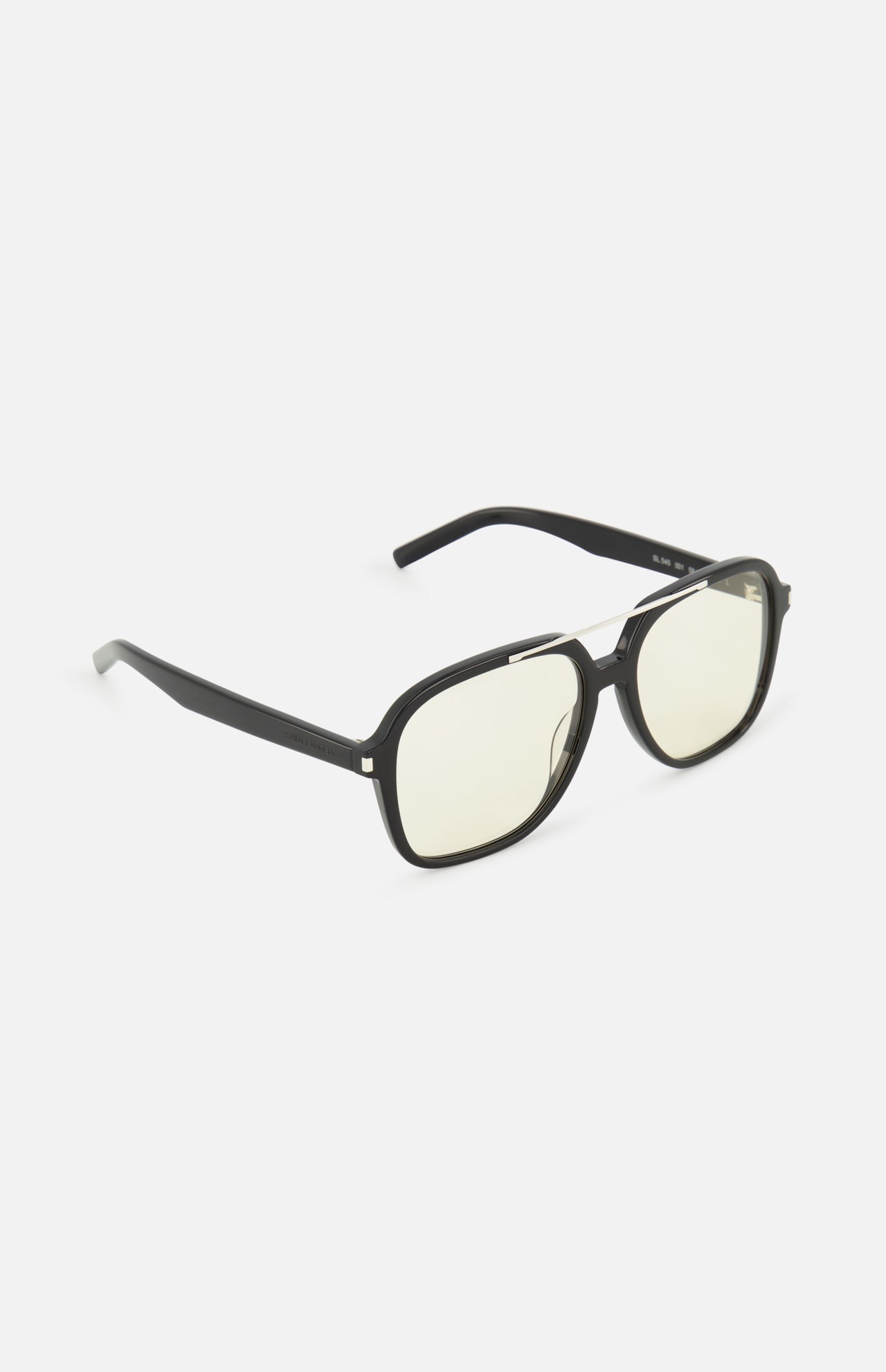 The YSL Aviator Black Sunglasses by YVES SAINT LAURENT feature oversized black frames and slightly yellow-tinted lenses with a retro-inspired design, shown at an angle on a white background.