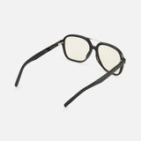 The YSL Aviator Black Sunglasses by YVES SAINT LAURENT feature retro-inspired black frames and slightly yellow-tinted lenses, displayed from the back with both arms extended against a plain white background.
