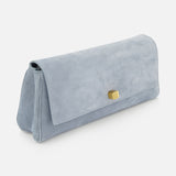 The KHAITE Audrey Art Deco Suede Clutch features soft pale blue suede, a rectangular silhouette, a fold-over flap, and gold-tone Art Deco hardware—perfect as an elegant cocktail party accessory.