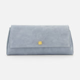 The KHAITE Audrey Art Deco Suede Clutch features pale blue suede in a rectangular shape with Art Deco-inspired front hardware—an ideal cocktail party accessory, shown against a plain white background.