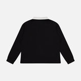 The KHAITE Faithful Vintage Rugby Top, a black unisex silk long-sleeve polo with a white collar, is displayed from the back against a plain white background.