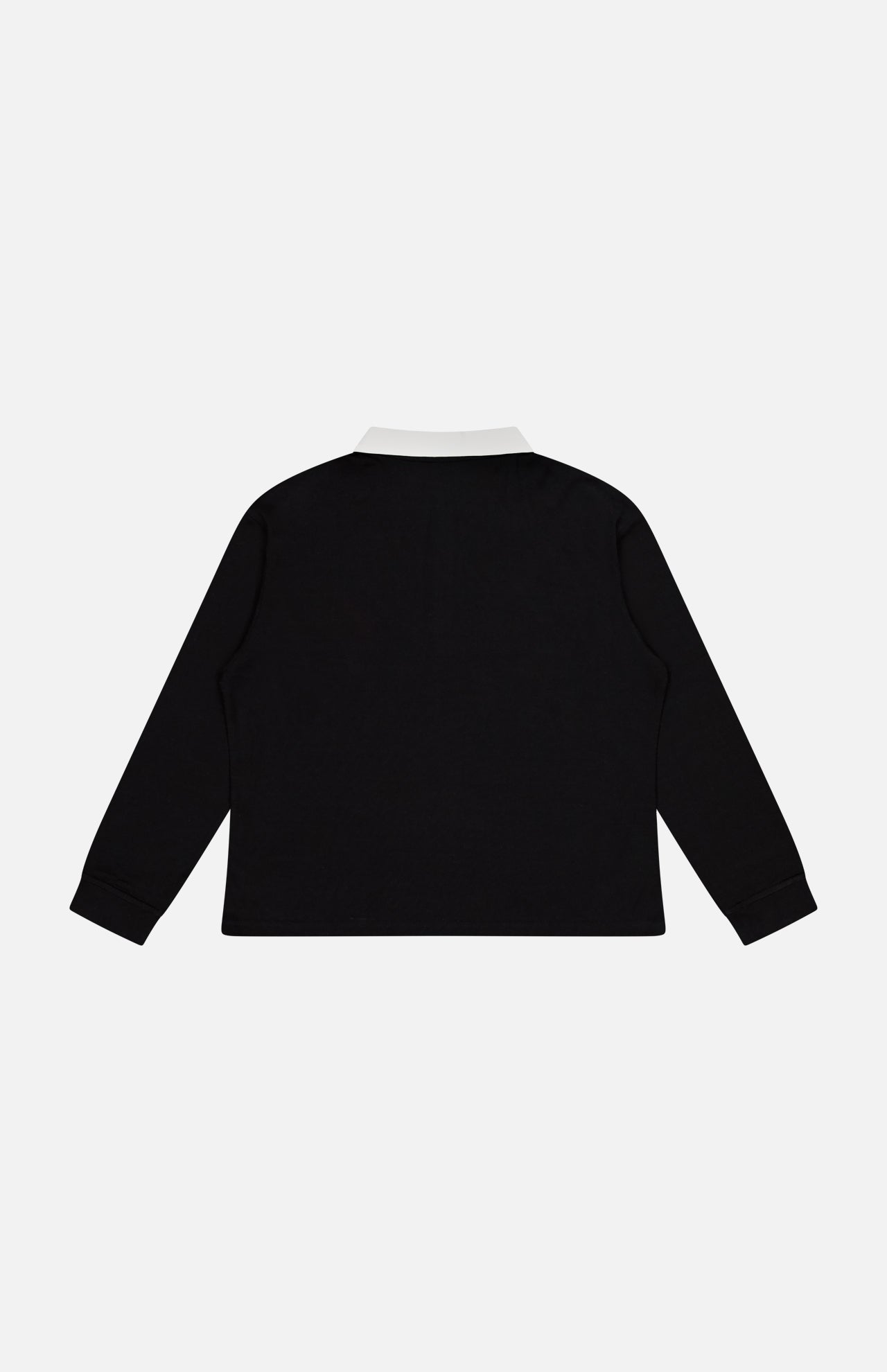 The KHAITE Faithful Vintage Rugby Top, a black unisex silk long-sleeve polo with a white collar, is displayed from the back against a plain white background.